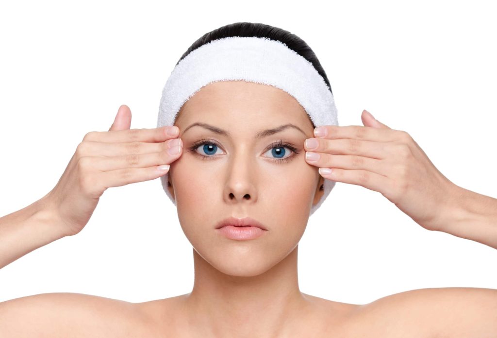 Woman Holding Face After Facelift